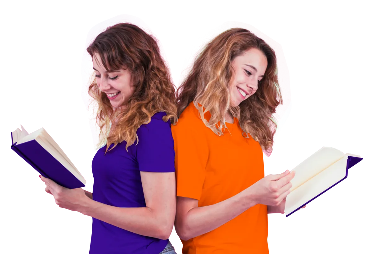 Two smiling students standing back to back, each reading an open book, one in purple and one in orange